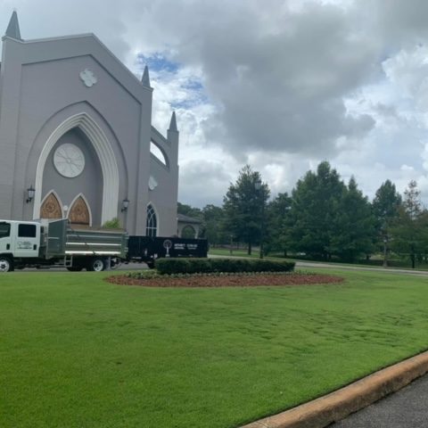 Expert grass mowing creating a clean and inviting outdoor environment for church